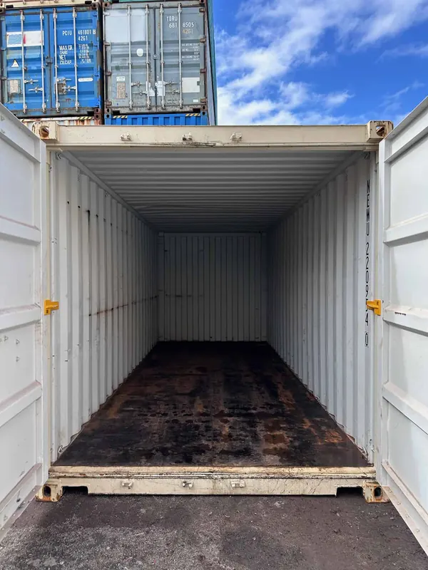 Both doors of an empty container braced open, one brace on each side